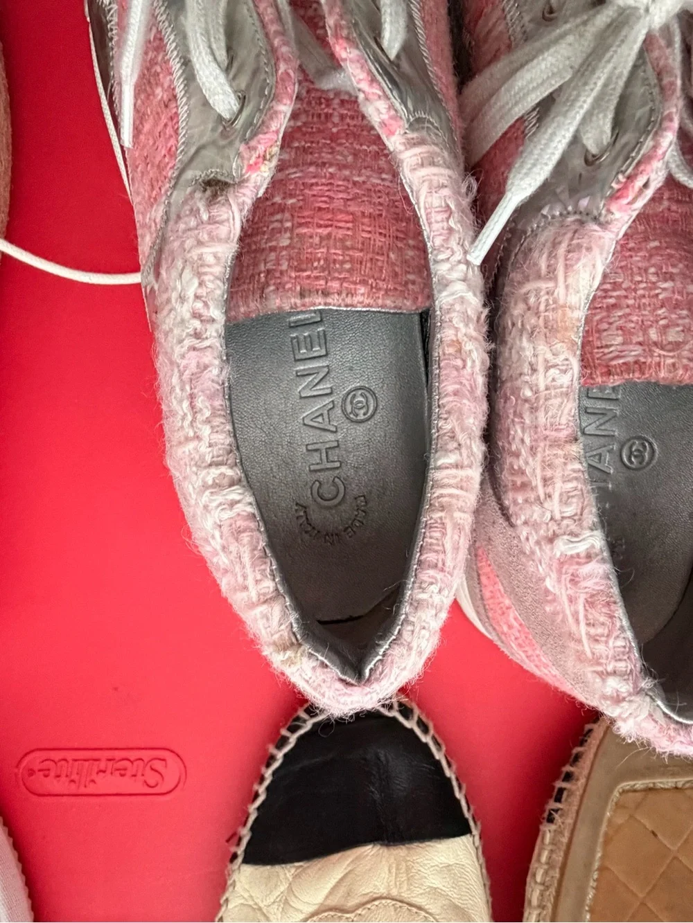 Chanel pink tweed trainers.